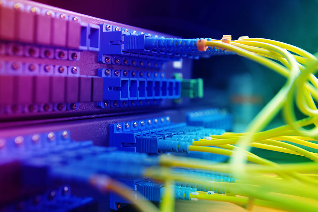 shot of network cables and servers in a technology data center